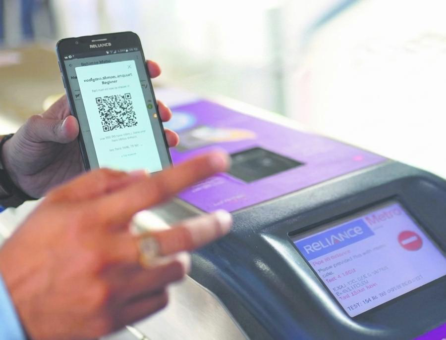 A commuter scanning at the gate — the interaction the whole project was built around.