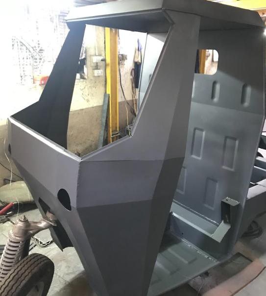 Cab in bare metal before paint.