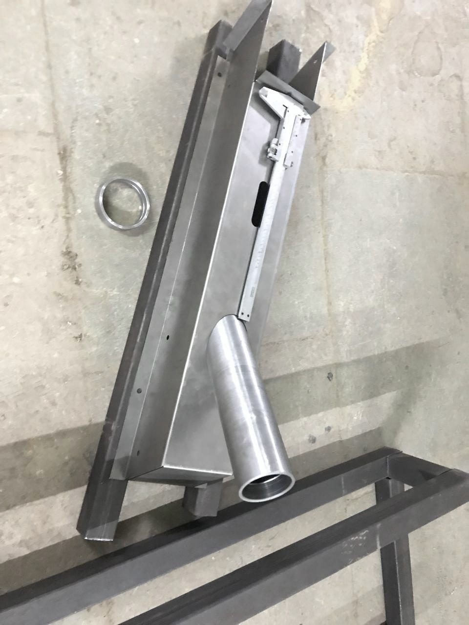 A welding fixture holding a Navya chassis member