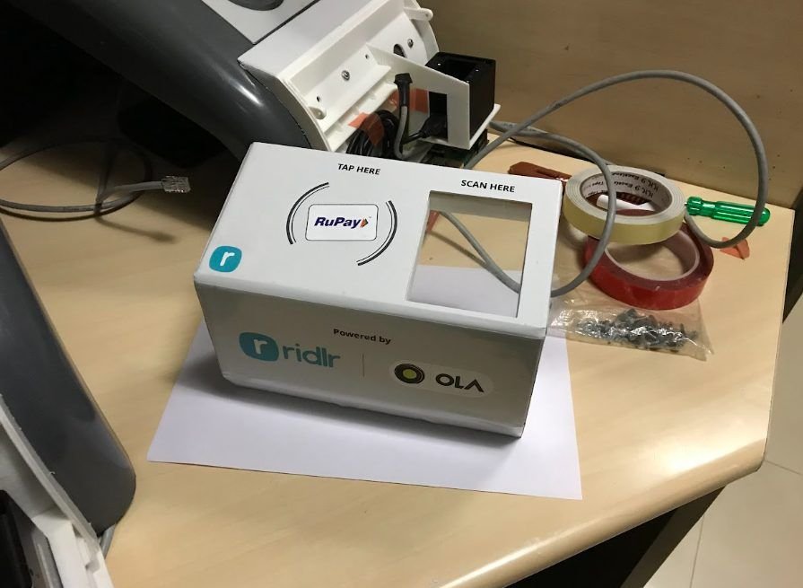 Tap-here / scan-here desktop unit branded RuPay, powered by Ridlr and Ola